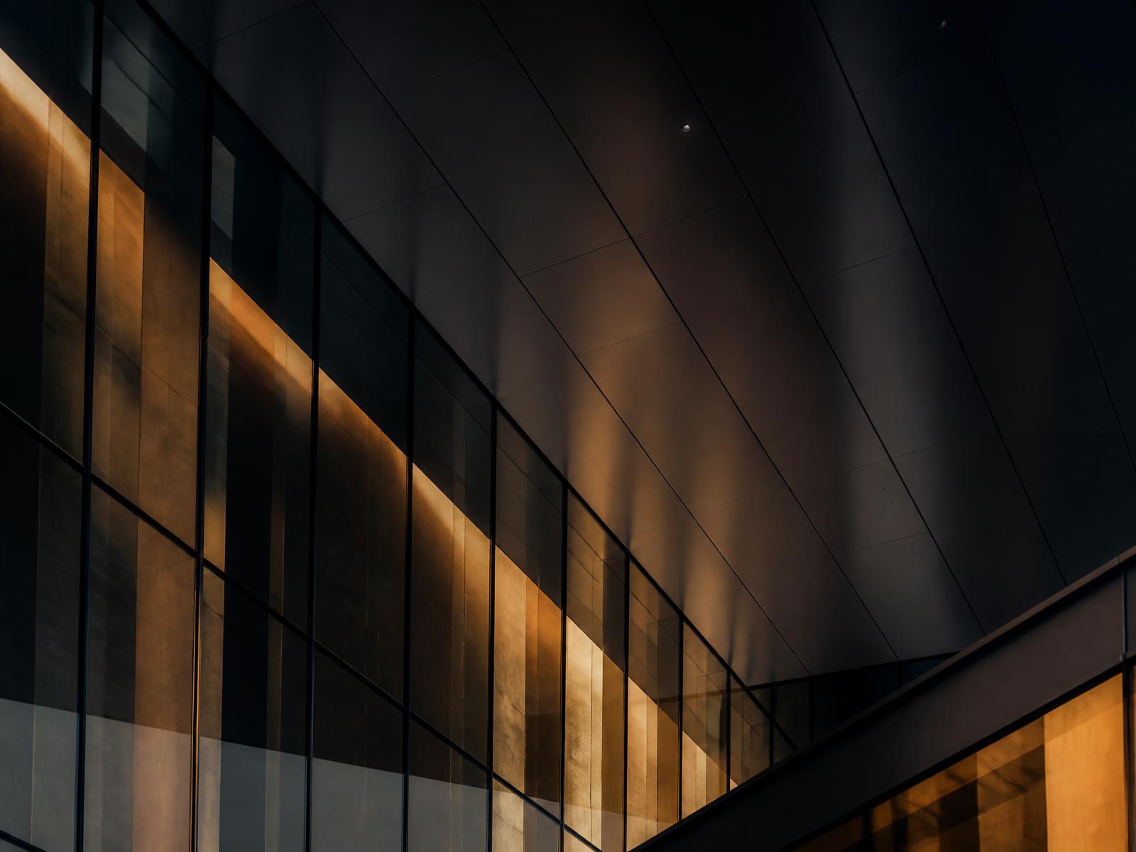 Detail of a modern corporate building facade at dusk